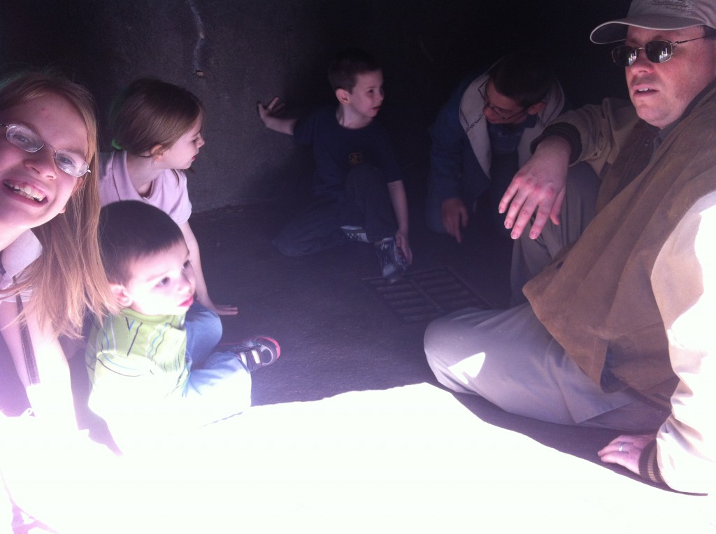 Scott went with the kids inside a small cave.